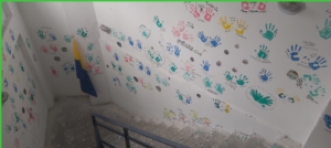 Cement wall with painting hand prints