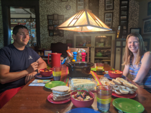 Couple at dining table eating dinner