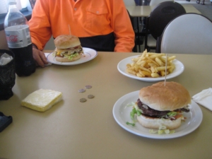 Diner table with plates of burgers and fries