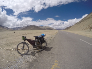 Bicycle parked along deserted road