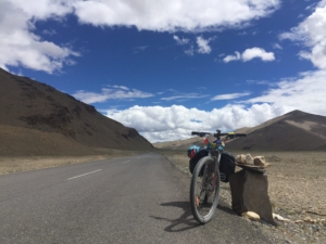 Bicycle parked along deserted road