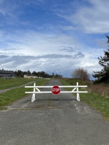 Empty road with a barrier and road closed sign