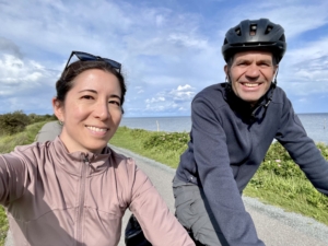 Closeup photo of a man and woman riding bicycles