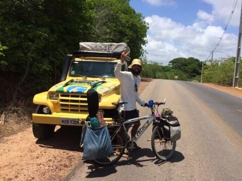 Cyclist walking on the road