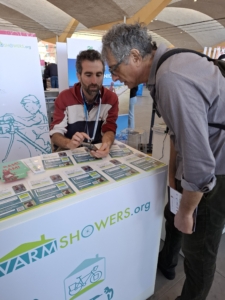 A person showing another something on his cell phone